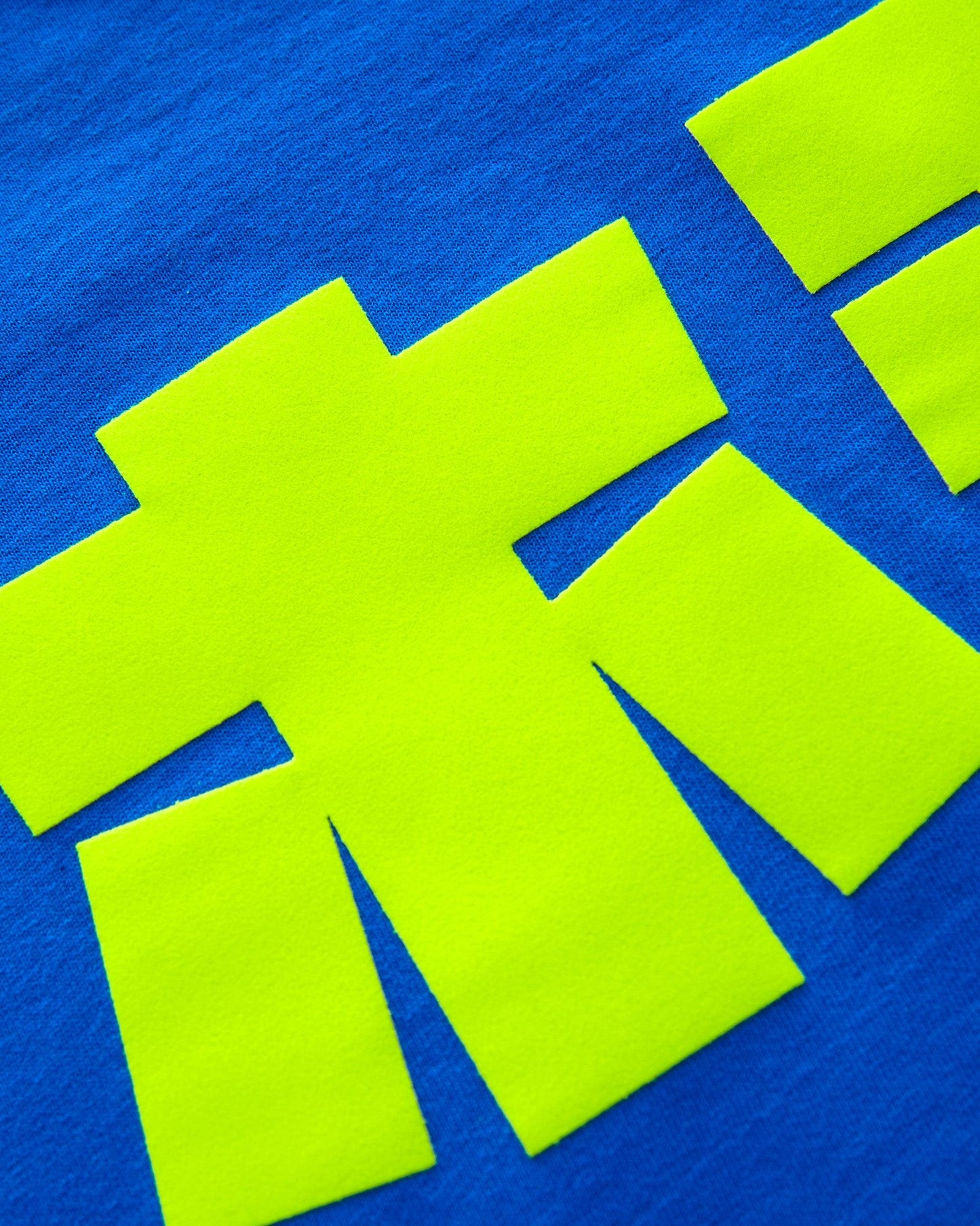 Fluorescent yellow flock HOMO in Japanese - blue crop top