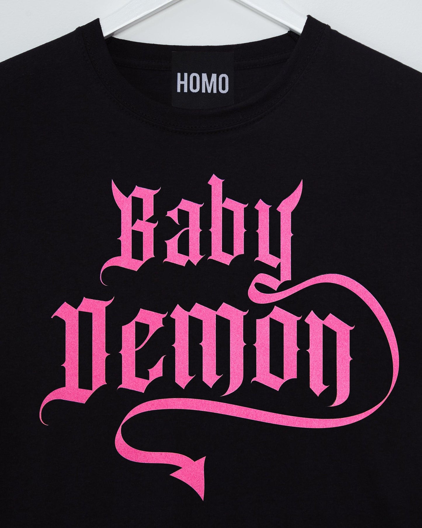 Baby Demon, pink flock on black muscle fit tee.