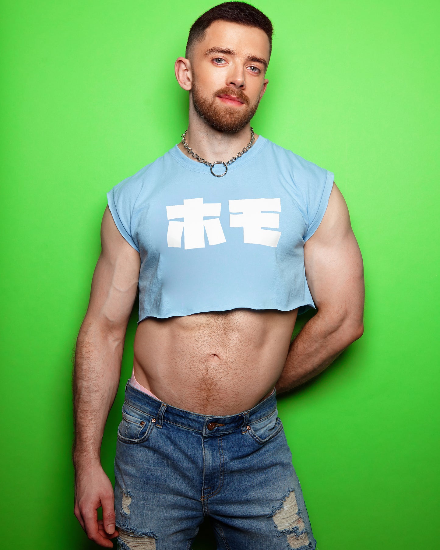 HOMO in Japanese in white on light blue sleeveless crop-top.